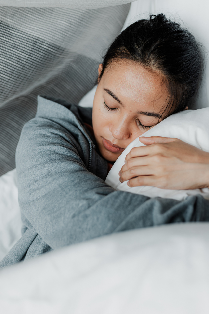 Woman Hugging Pillow While Sleeping